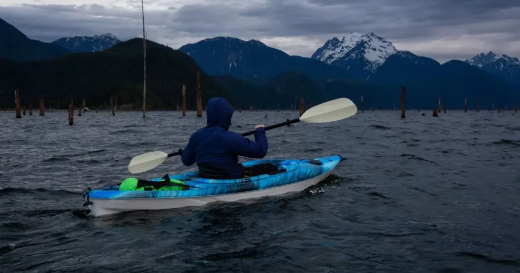 man kayaking in cold weather