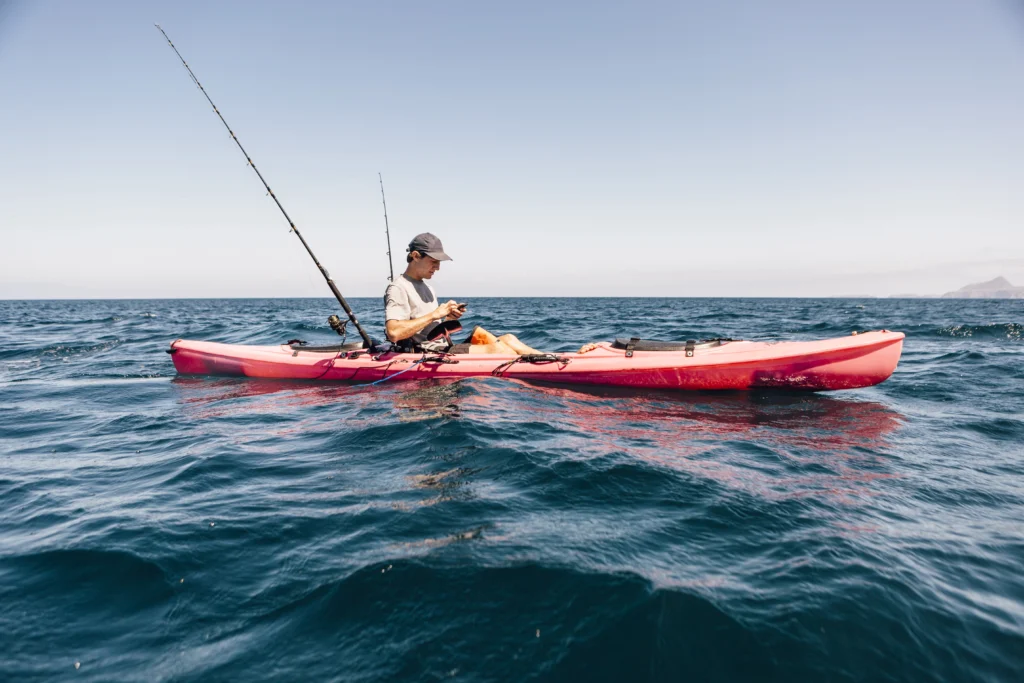 man ocean fishing from a kayak